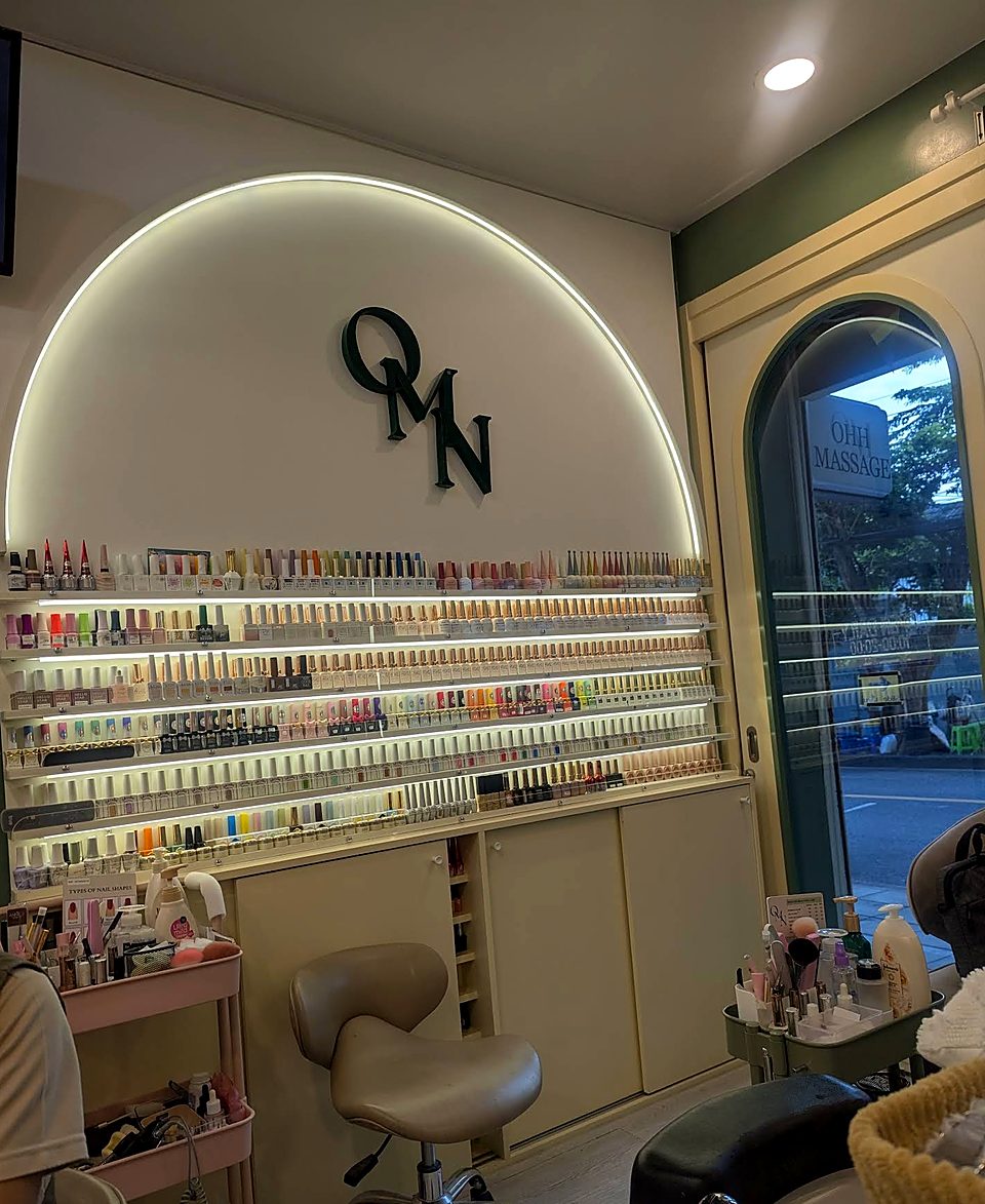 The polish wall and lit arch inside the salon